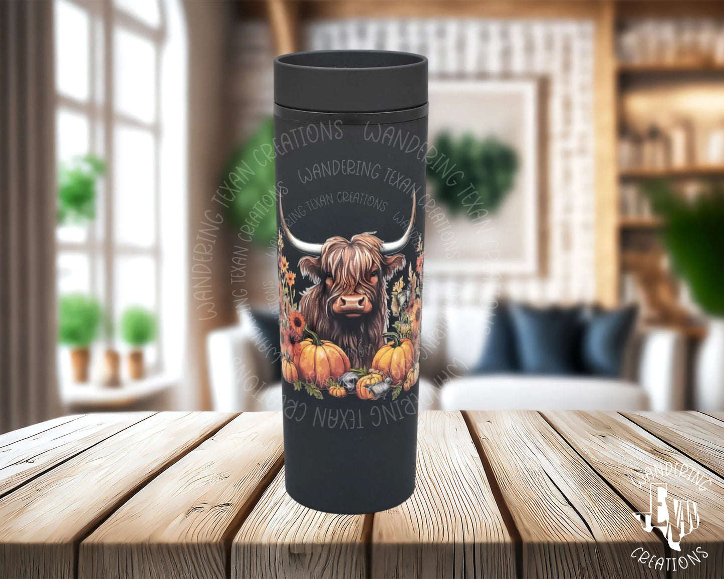 This quirky tumbler features a charming highland cow amidst a patch of pumpkins.