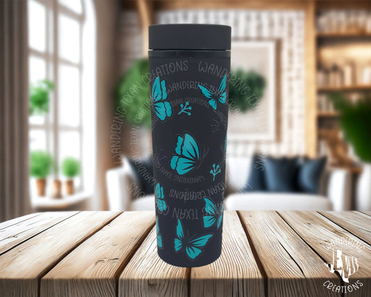 Featuring UV DTF decals of black and teal butterflies, this tumbler adds a playful touch to your sipping experience.