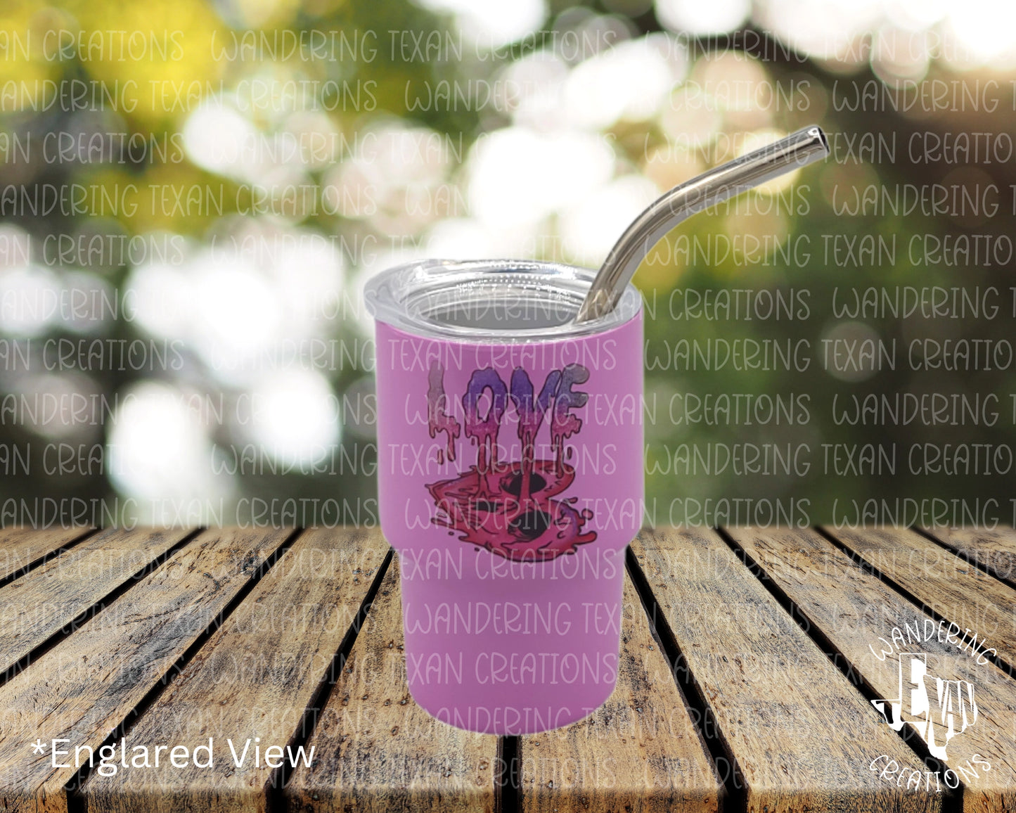 Sip from this quirky, mini 3 oz purple tumbler, featuring a playful design of the word love dripping into a heart.