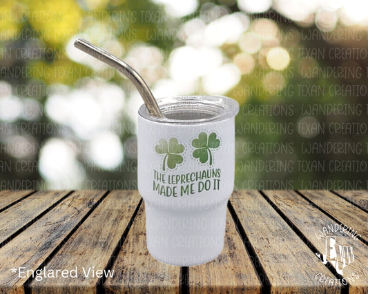 Take a shot with this playful mini tumbler featuring the phrase "The leprechauns made me do it" and three leaf clovers.