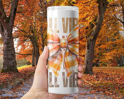 Made with durable stainless steel and a 30 oz capacity, it's perfect for keeping your favorite beverages hot or cold on the go. The sublimated design features a trendy fall plaid bow and the phrase "fall vibes" for a seasonal touch.