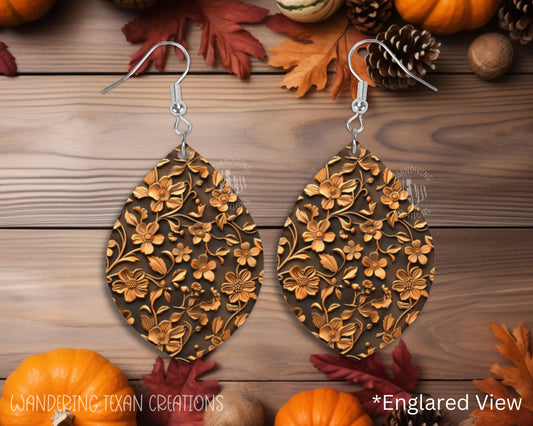 These quirky Copper Bloom Earrings feature a dark brown background complements the copper floral and leaf pattern for a unique and playful look.