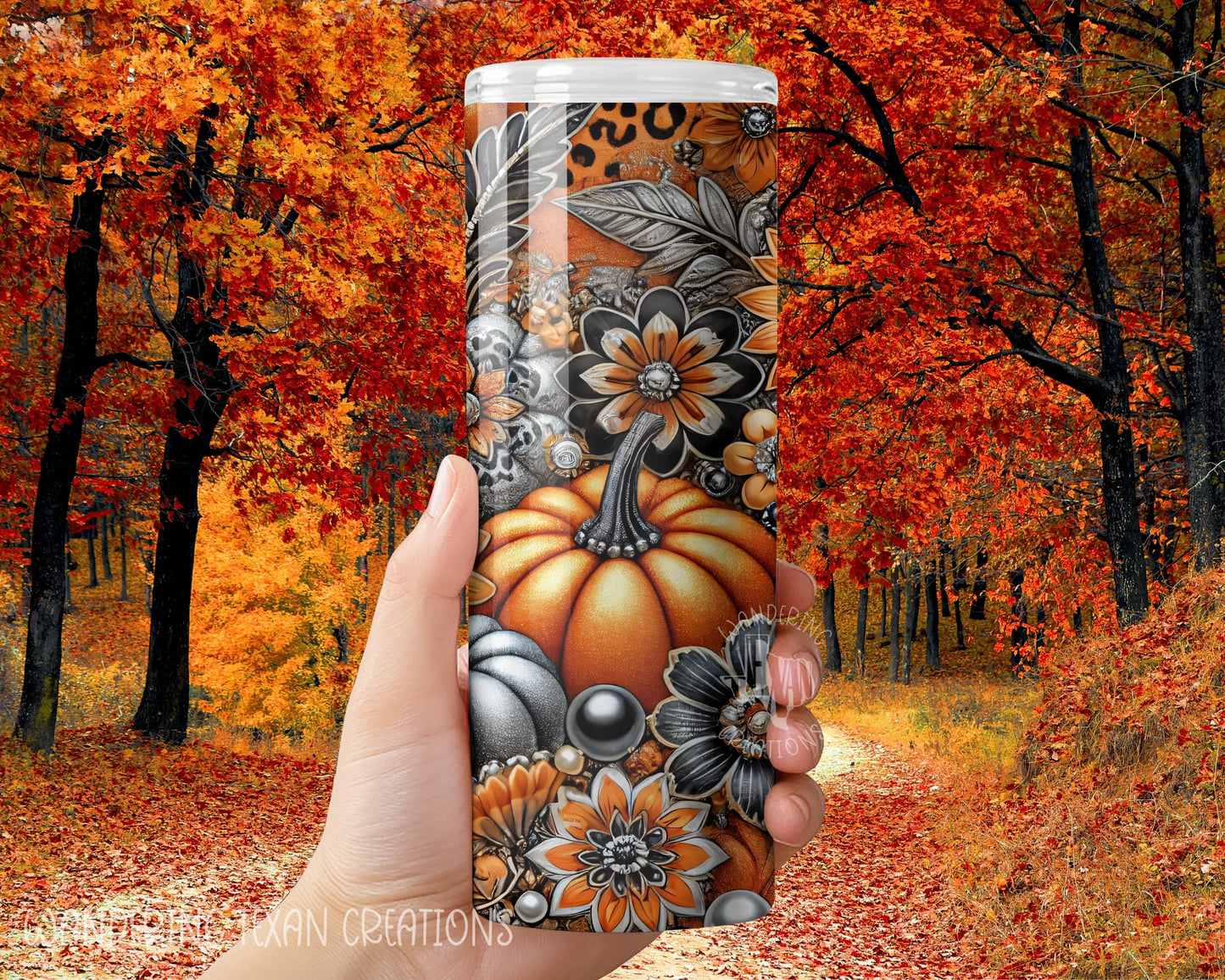 This seasonal tumbler boasts a unique design of pumpkins and fall florals in a color scheme of orange, black, white, and silver.