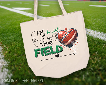 Made from durable canvas, this bag features a heart-shaped football design and the phrase "My heart is on that field" (get it?).