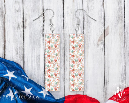  These quirky earrings feature a playful design of red, white, and blue ice cream, perfect for celebrating the 4th of July. 