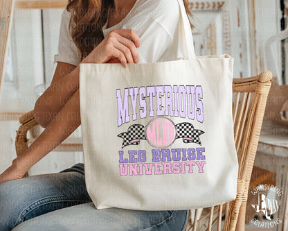 Featuring a distressed design with the quirky phrase "Mysterious Leg Bruise University", this large capacity tote is perfect for moms on the go.