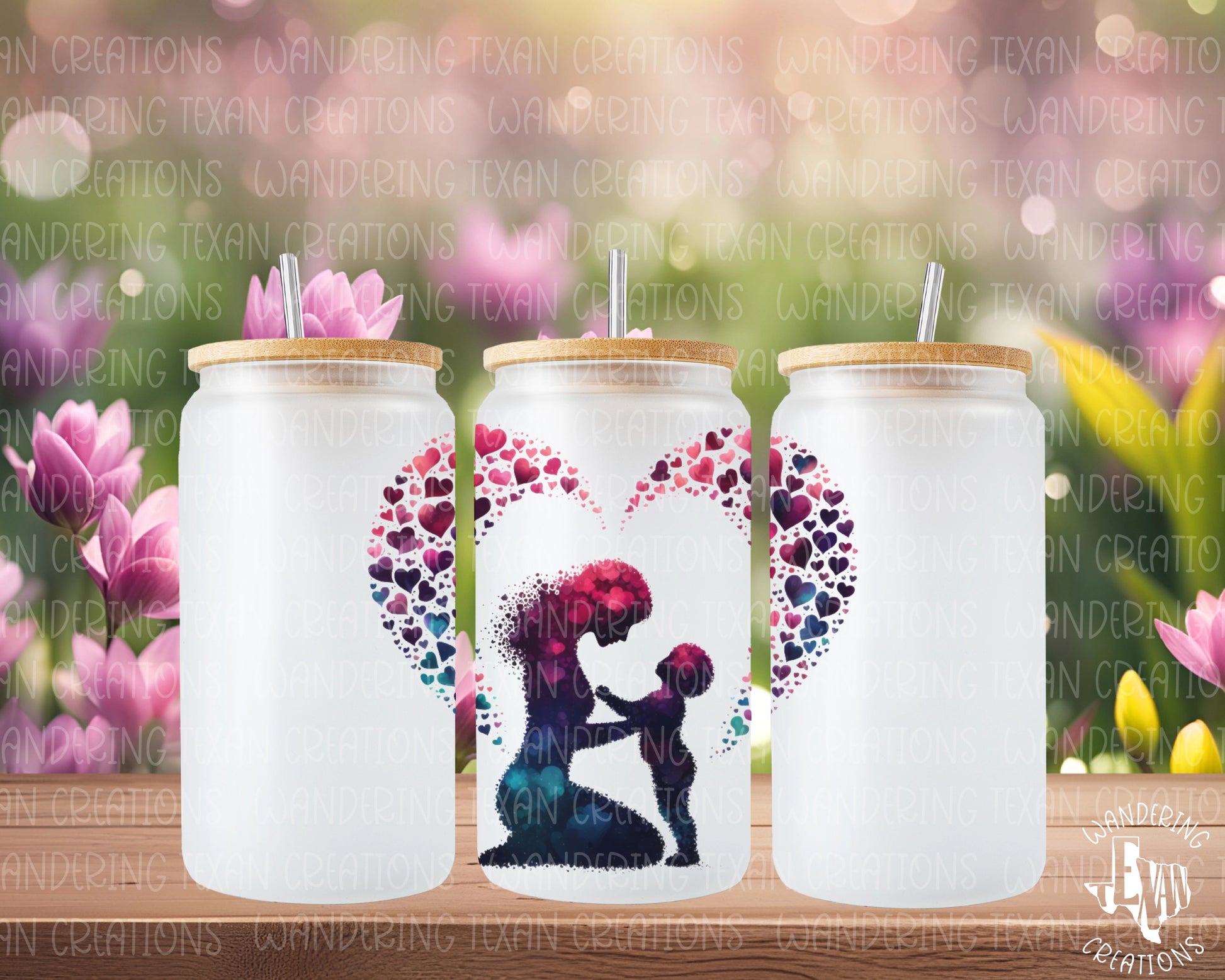 This frosted glass tumbler features a unique silhouette design of a mom and child made of overlapping hearts, with a heart surrounding both.