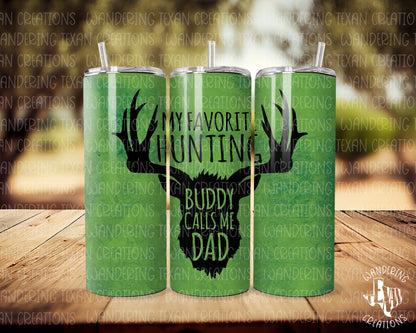 Expertly designed for hunting enthusiasts, the Hunting Buddy Tumbler features a sleek silhouette of a deer and the heartwarming phrase "My favorite hunting buddy calls me dad". 