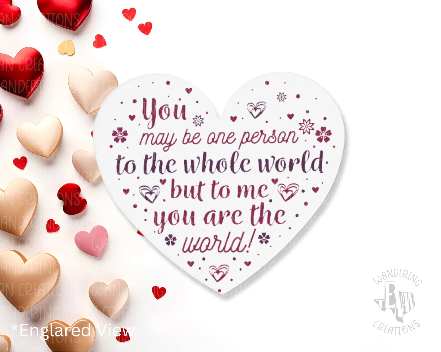 This vibrant heart-shaped magnet features the inspiring phrase "You may be one person to the whole world but to me, you are the world!" and is sublimated to last a lifetime.