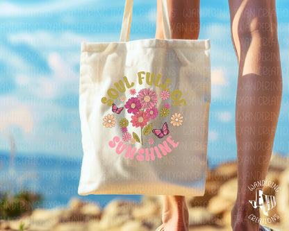 Experience the magic of summertime with our Meadow Magic Tote Bag. The vibrant sublimation design features a picturesque bundle of summer flowers alongside graceful butterflies and the inspiring phrase "soul full of sunshine".