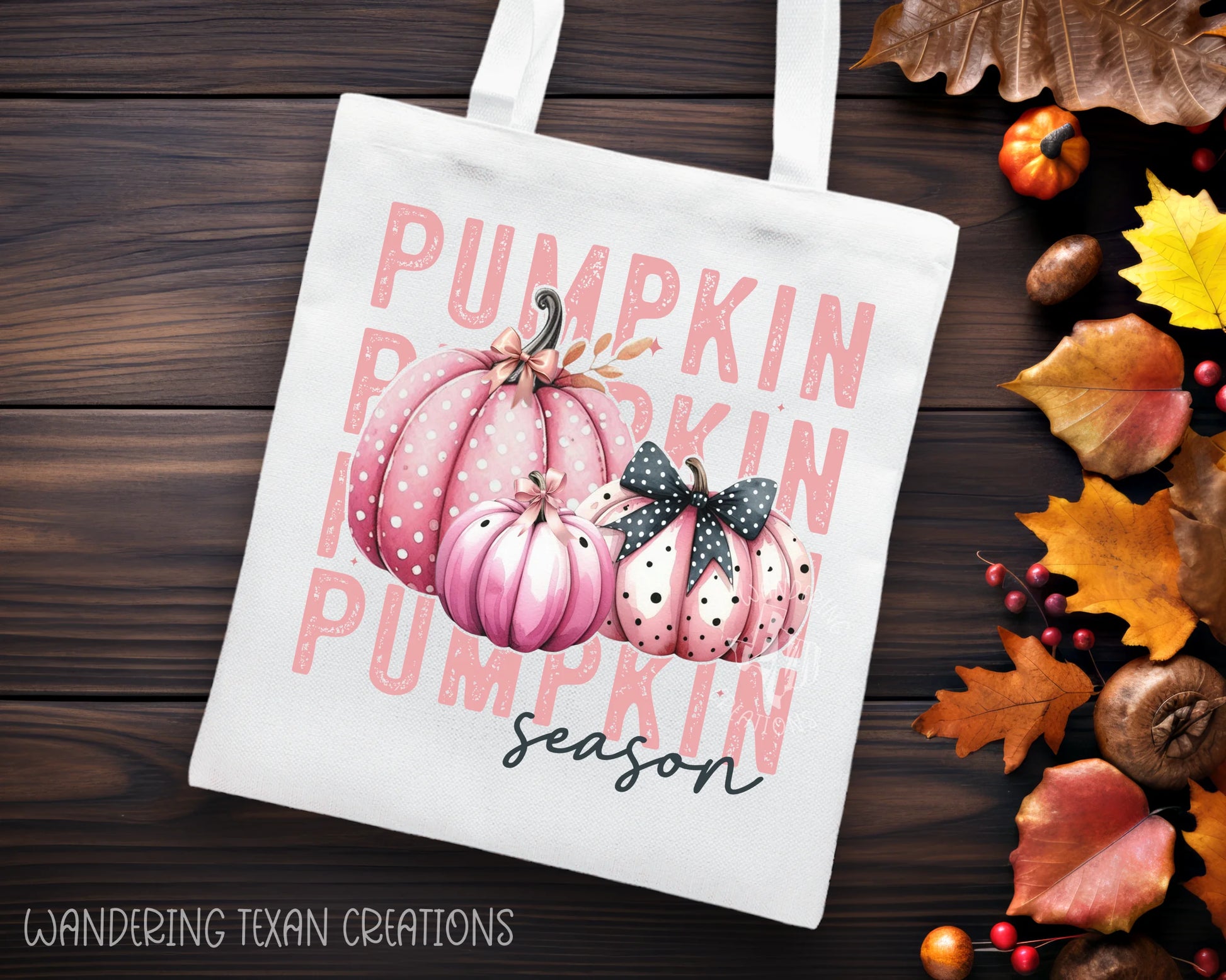  This seasonally themed tote bag features a playful design of pink polka dot pumpkins with the word "pumpkin season" stacked in the background. 