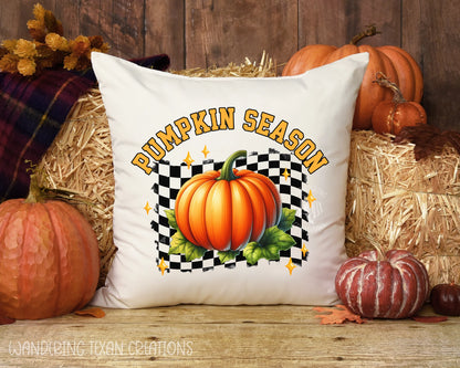 This festive and fun design features a large pumpkin sitting on a green patch against a black and white checkered backdrop, with the phrase "Pumpkin Season" above.