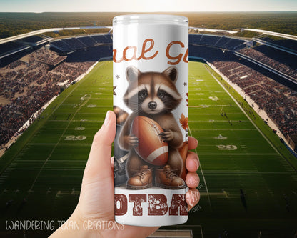 Keep your drinks hot or cold with this 30 oz tumbler featuring a punny design of a raccoon holding a football while standing in front of a helmet and pumpkin. Perfect for the feral girl football fan in your life.