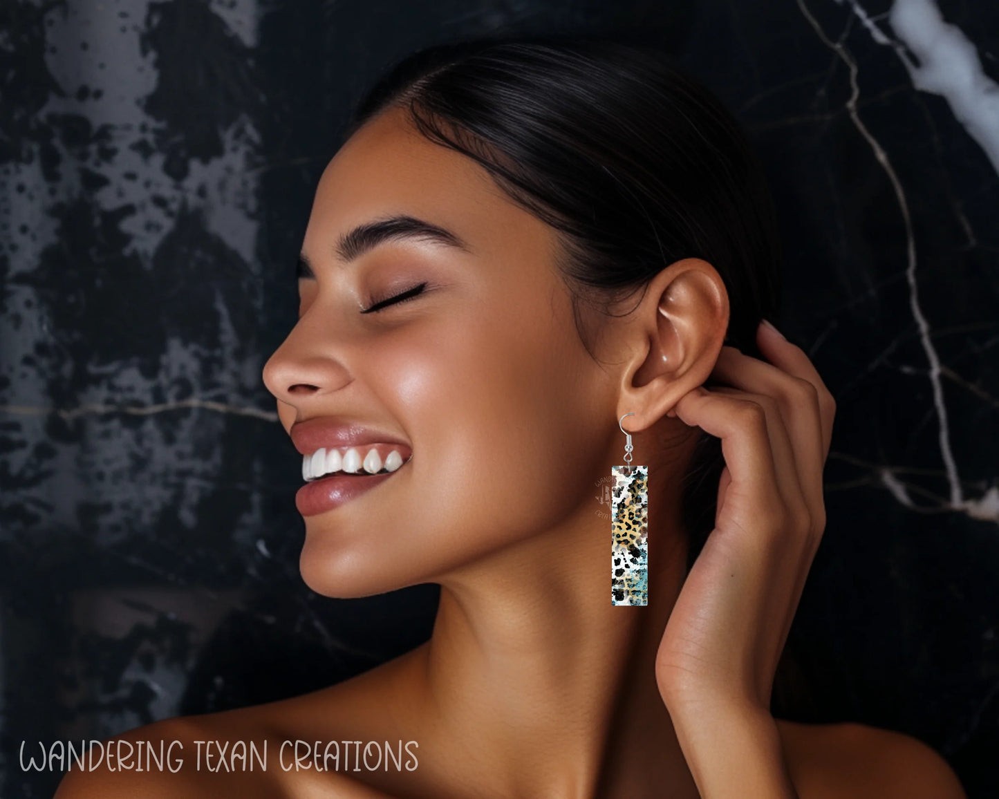 Featuring a playful mix of animal prints and a pop of teal, these sublimated, rectangle-shaped earrings add a touch of whimsy to any outfit.