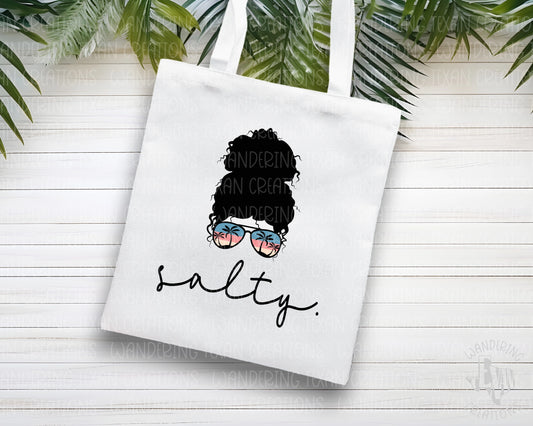 Featuring a bold sublimation design and a "Salty" phrase paired with a confident woman sporting sunglasses that have a palm tree reflection, this tote is the perfect accessory for your summer adventures!