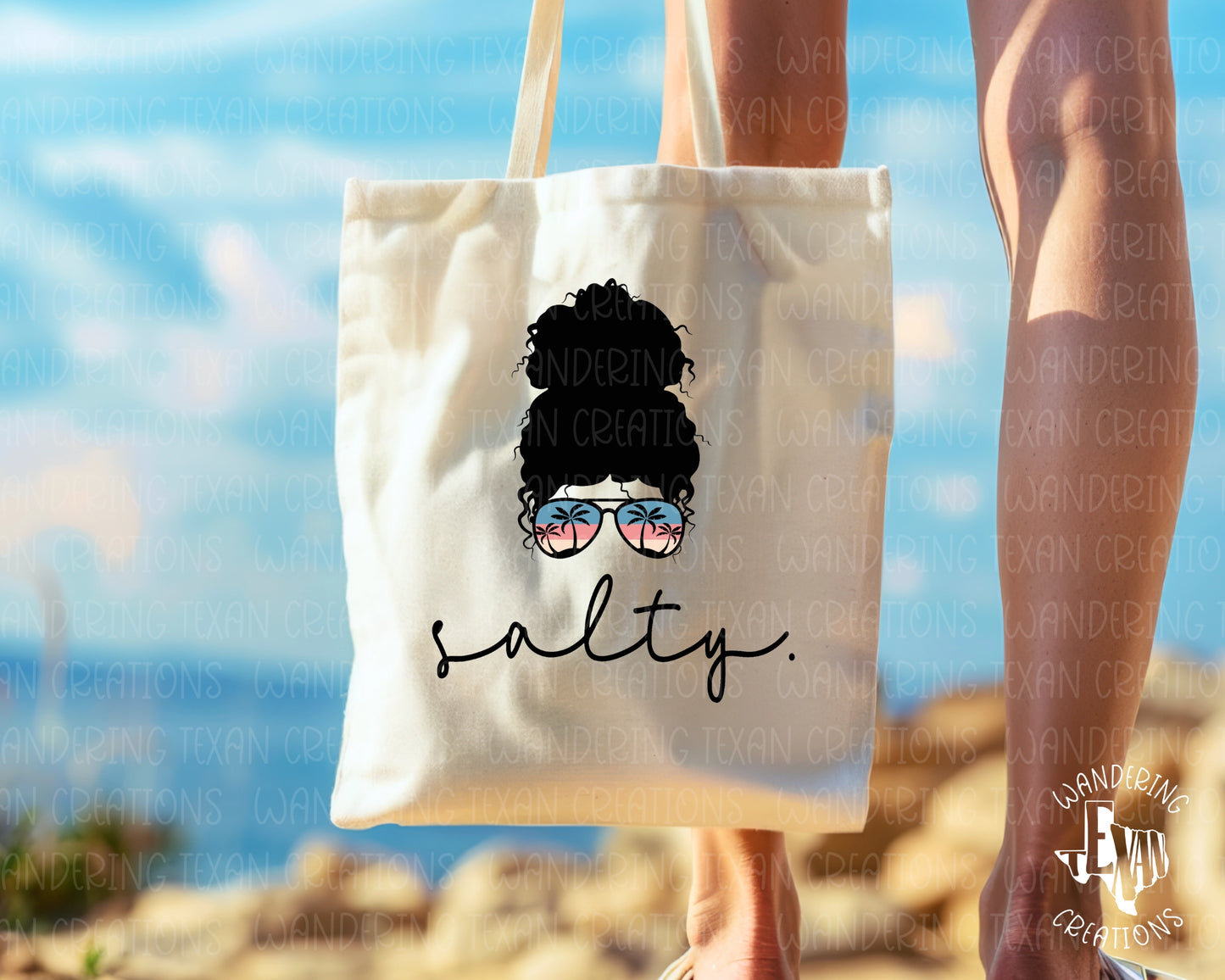 Featuring a bold sublimation design and a "Salty" phrase paired with a confident woman sporting sunglasses that have a palm tree reflection, this tote is the perfect accessory for your summer adventures!