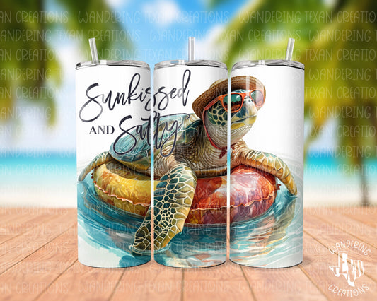 Sip in the "chill zone" with this sea turtle-themed tumbler! The sublimation design features a turtle relaxing on a floatie donning a hat and sunglasses. Plus, the playful phrase "Sunkissed and salty" adds a touch of summer fun.