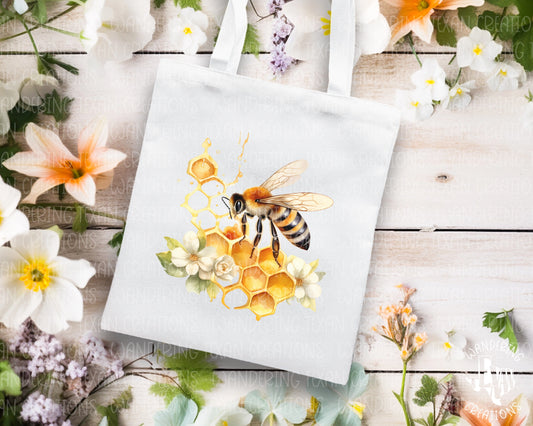 Carry your things with buzz in this Wild Honeycomb &amp; Bee tote bag. Perfect for spring adventures, the sublimation design adds a touch of whimsy.