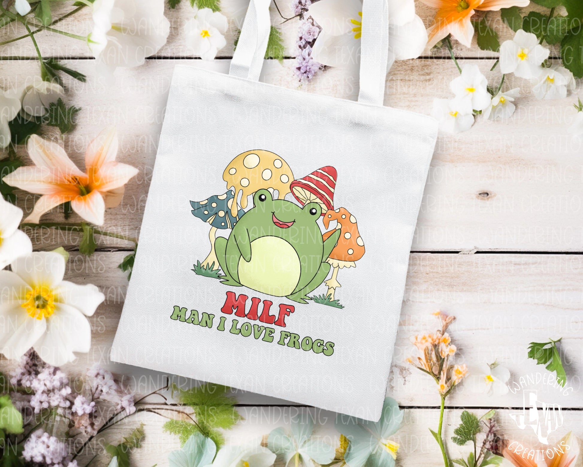 Hop into spring with our Sweet Frog Tote Bag! Featuring a cute frog amidst flowers and toadstools, and the phrase "MILF, man I love frogs," this bag is perfect for any frog lover.