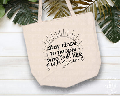 With a sublimation design featuring the phrase "Stay close to people who feel like sunshine", this bag will be your summer go-to.