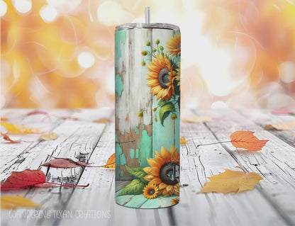 This seasonal tumbler features a playful design with cowboy boots filled with sunflowers against a rustic teal wood background.