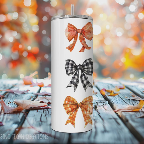 The quirky design of orange and black bows, with a touch of plaid, will add some fun to your daily tumbler routine.