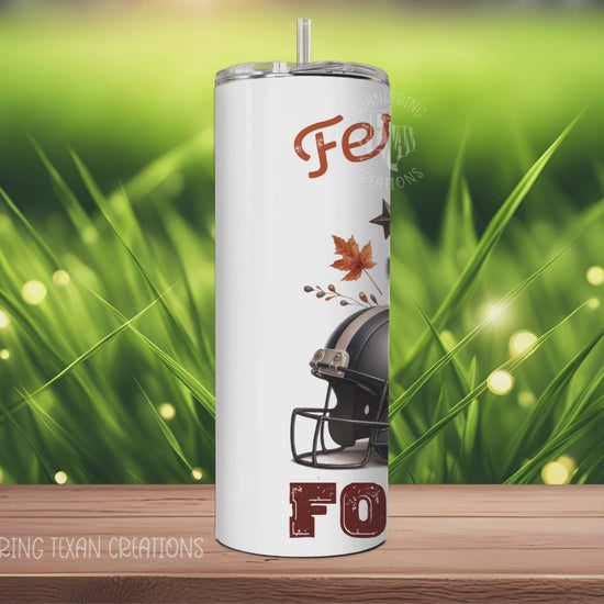 Keep your drinks hot or cold with this 30 oz tumbler featuring a punny design of a raccoon holding a football while standing in front of a helmet and pumpkin. Perfect for the feral girl football fan in your life.