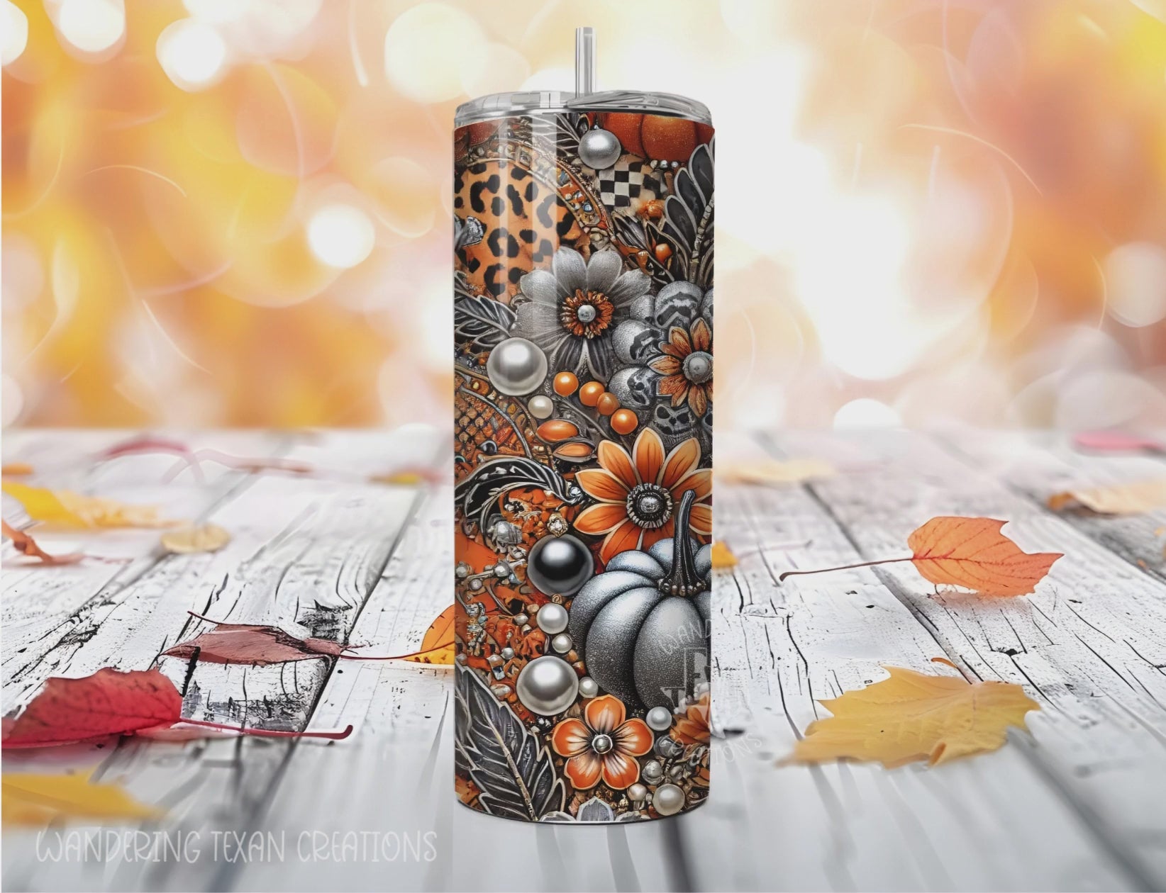 This seasonal tumbler boasts a unique design of pumpkins and fall florals in a color scheme of orange, black, white, and silver.