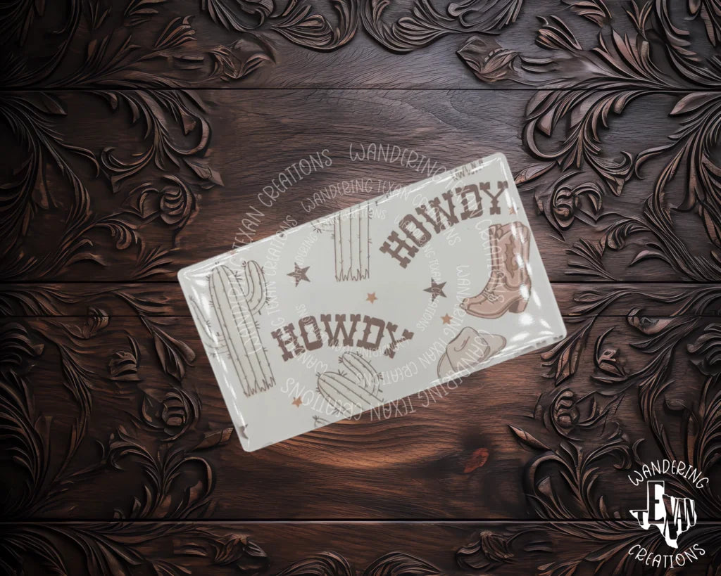 Greet your fridge with the Howdy Magnet. Featuring a sassy "howdy" design complete with cowboy boots and cactus, this magnet uses sublimation to make a lasting impression.