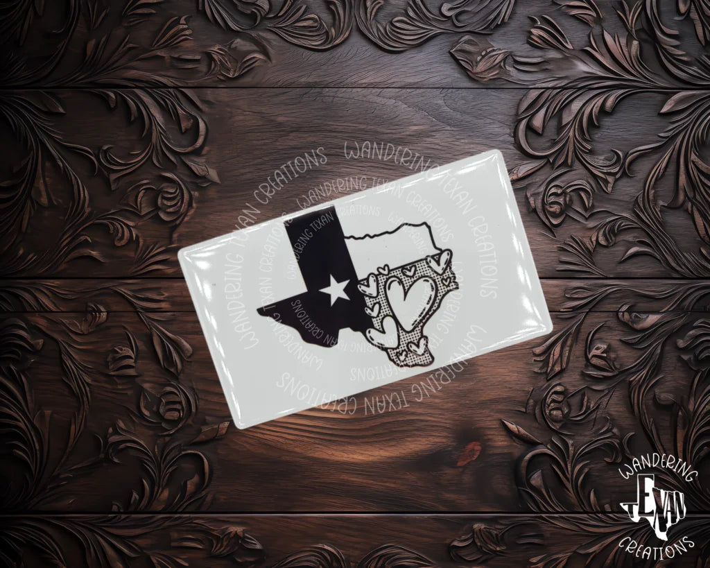 Show off your love for Texas with this quirky magnet featuring a flag silhouette and heart shapes. 